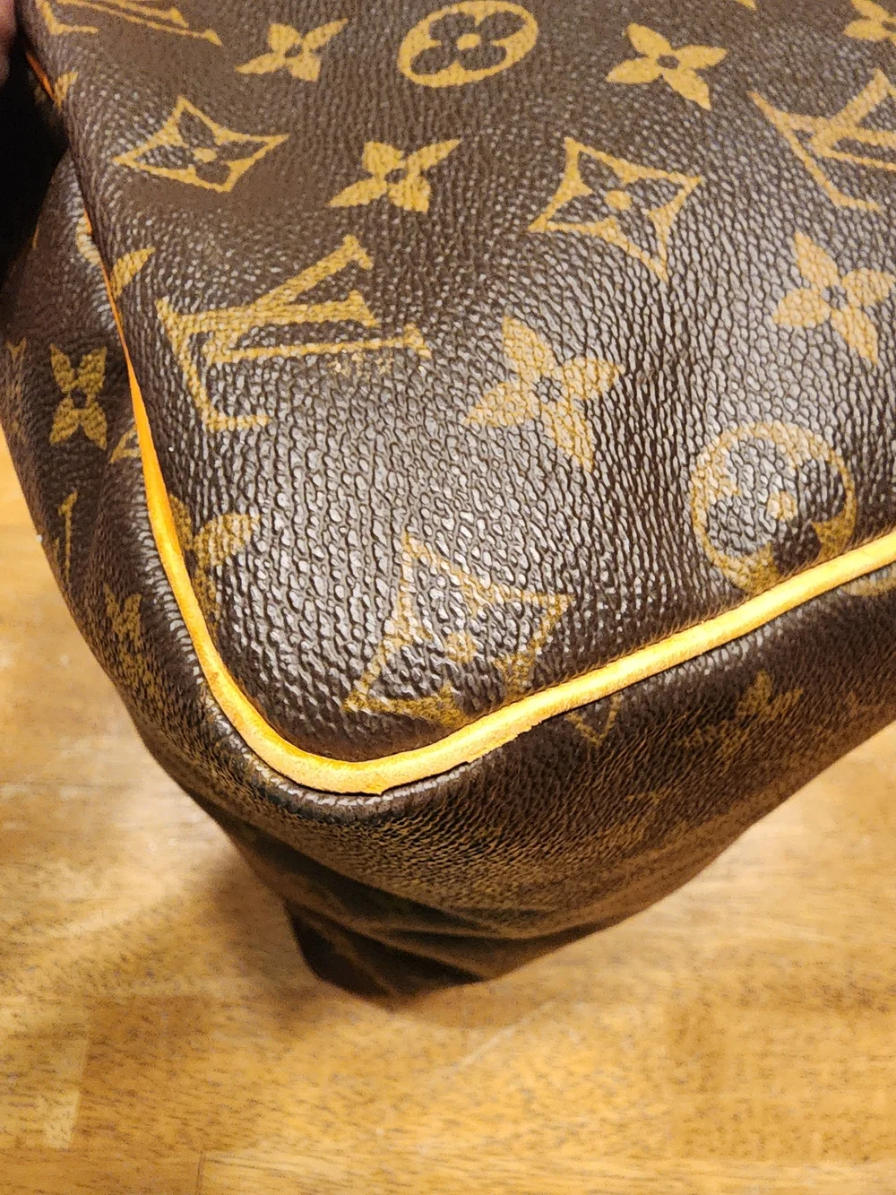 classic Louis Vuitton Monogram Speedy 30 featuring iconic brown coated monogram
